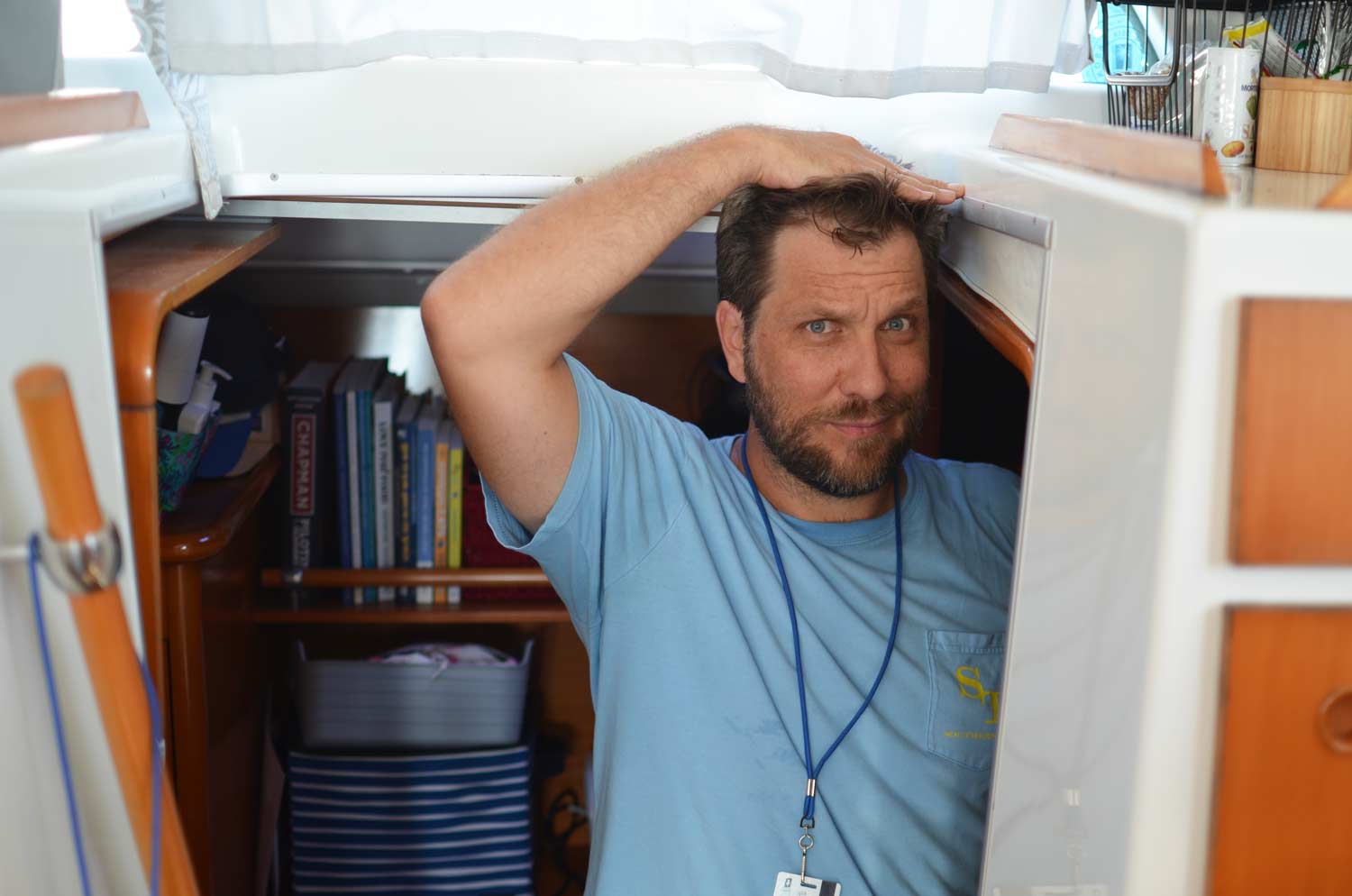 Sunnyside crew demonstrating the height in a catamaran cabin