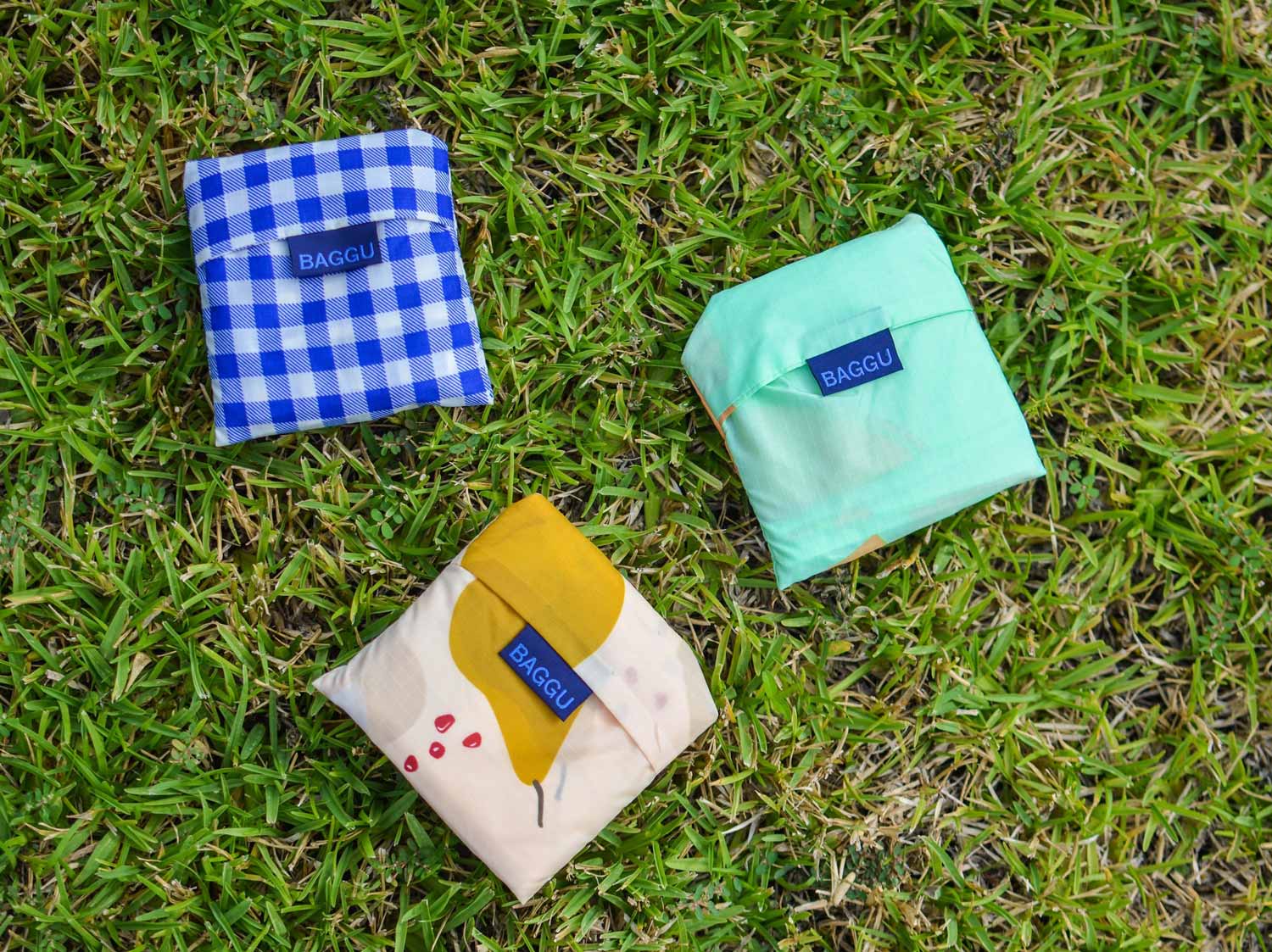 reusable bags folded up and stored in individual small pouches