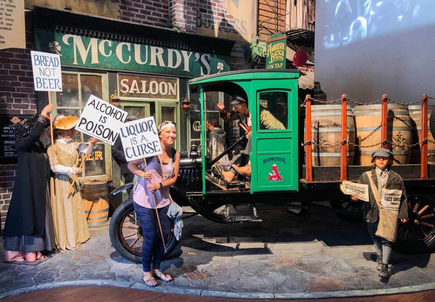 woman holding prop in display at the prohibition Museum