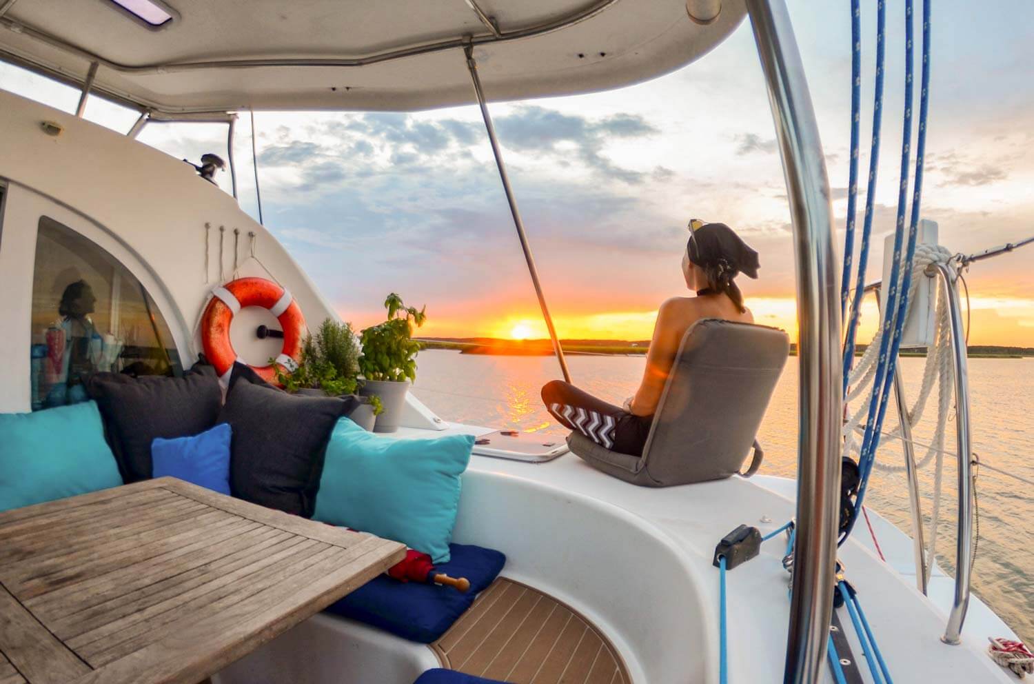 Crew member sitting in the cockpit viewing a sunset at ancho