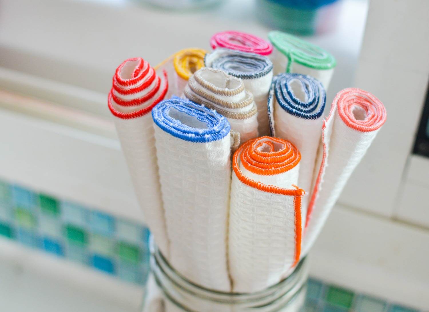 reusable paper towels rolled and stored in glass jar