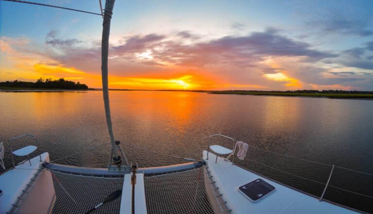 catamaran anchored at sunset