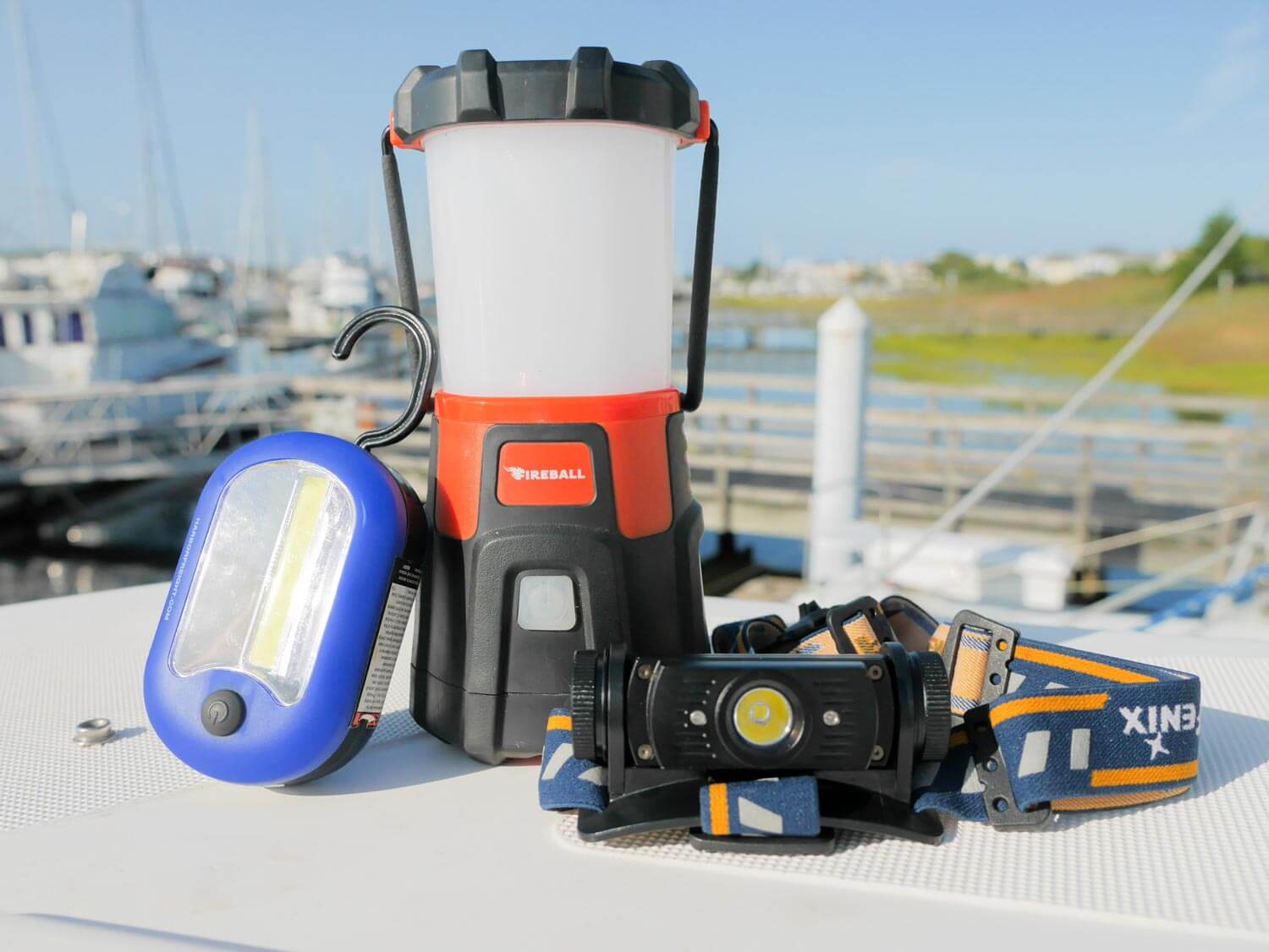 assortment of types of lights and lanterns on boat deck