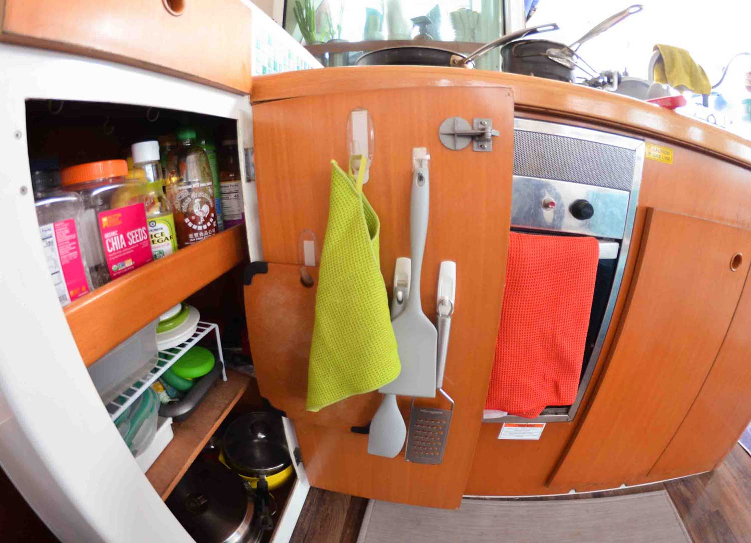 hanging storage in boat galley cabinet
