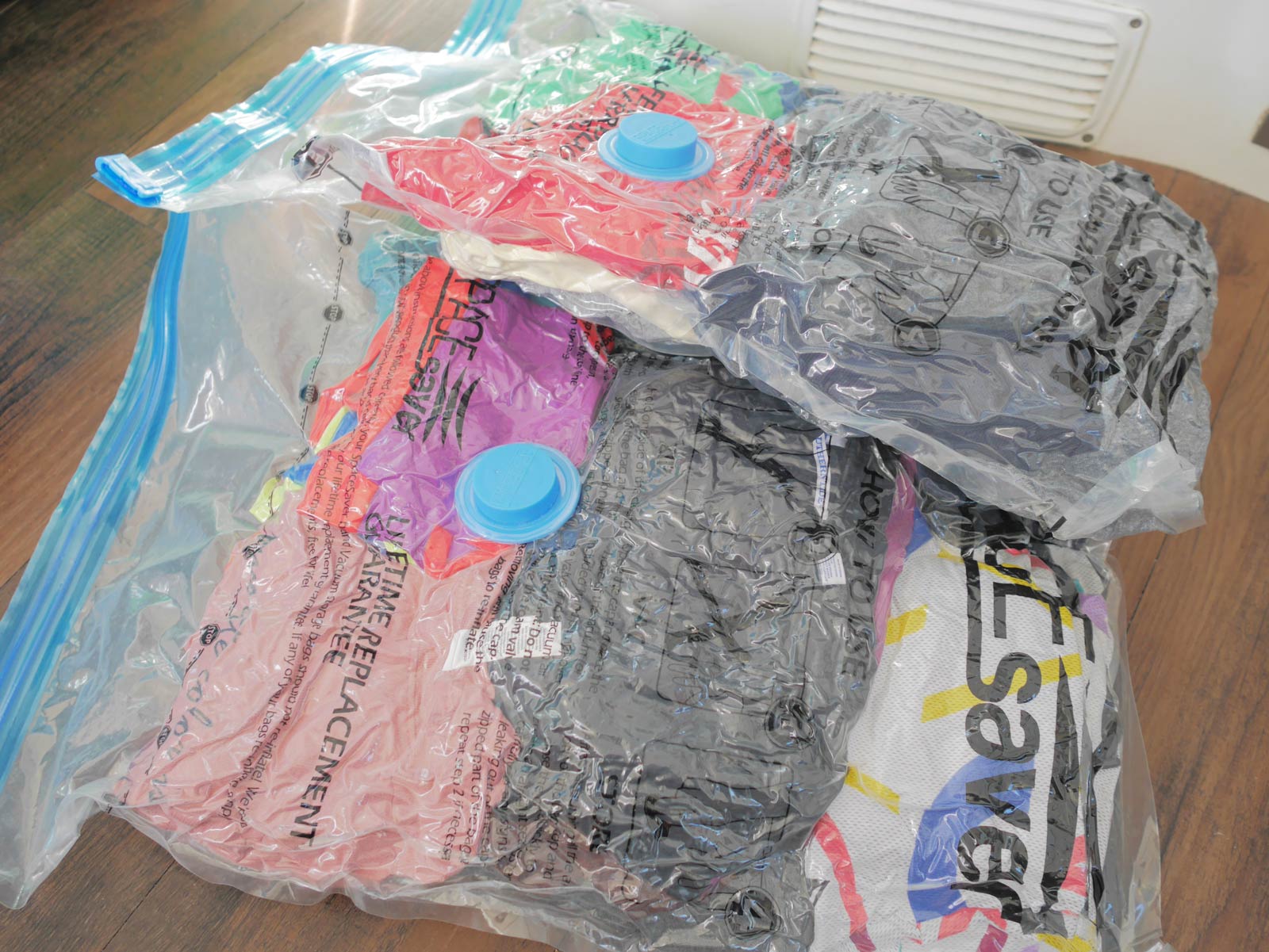 two vacuum storage bags containing clothes