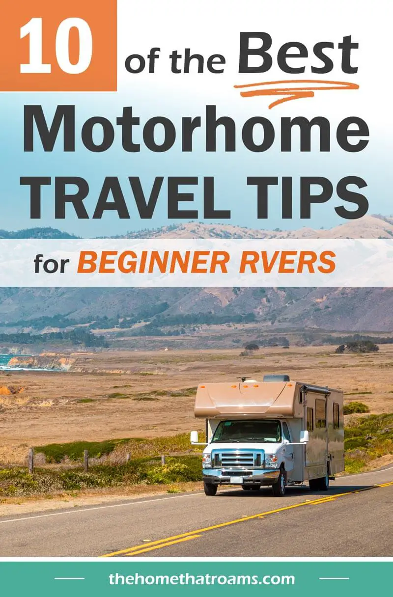 pin of motorhome driving down highway with mountains as a backdrop