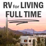 pin of RV parked in desert with mountains in the background