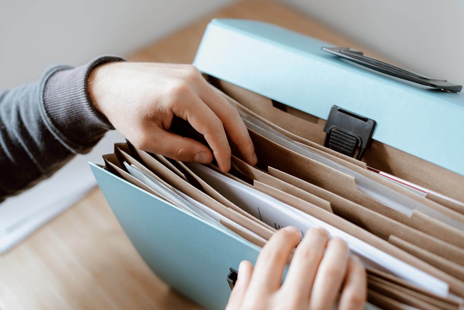 Person sorting through filing system