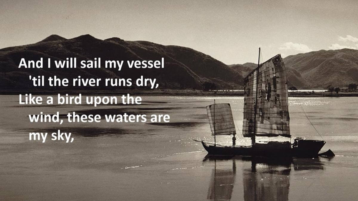 Old sailboat on the water with lyrics from Garth Brooks' song "The River" overlayed.