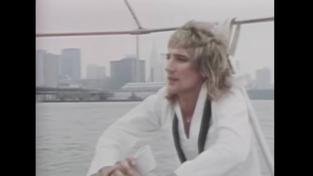 Rod Stewart on a boat in his music video for the song "Sailing".