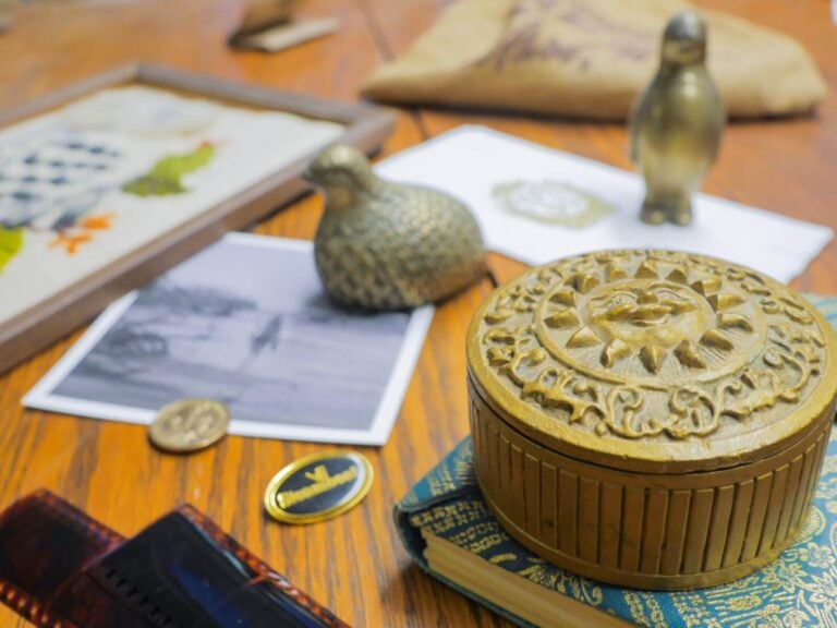 sentimental items and photos scattered across a table