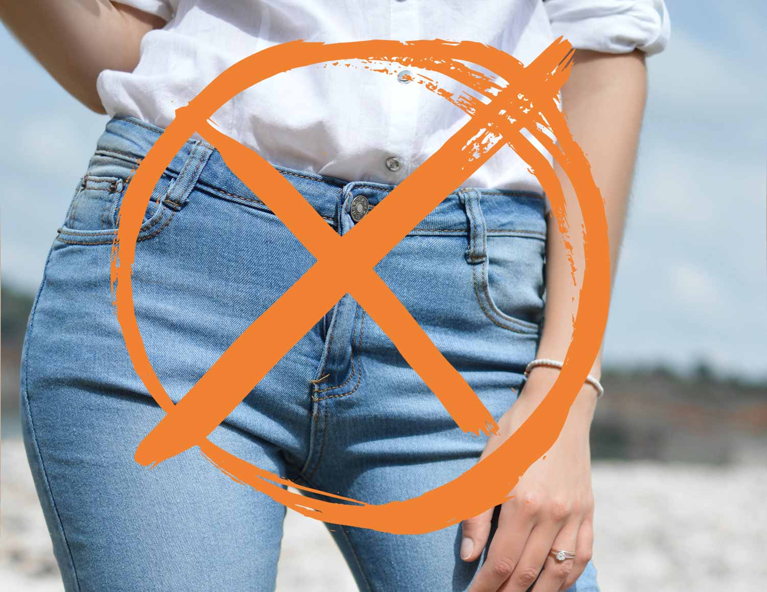 close up of woman in jeans, button up shirt with 'X' over picture