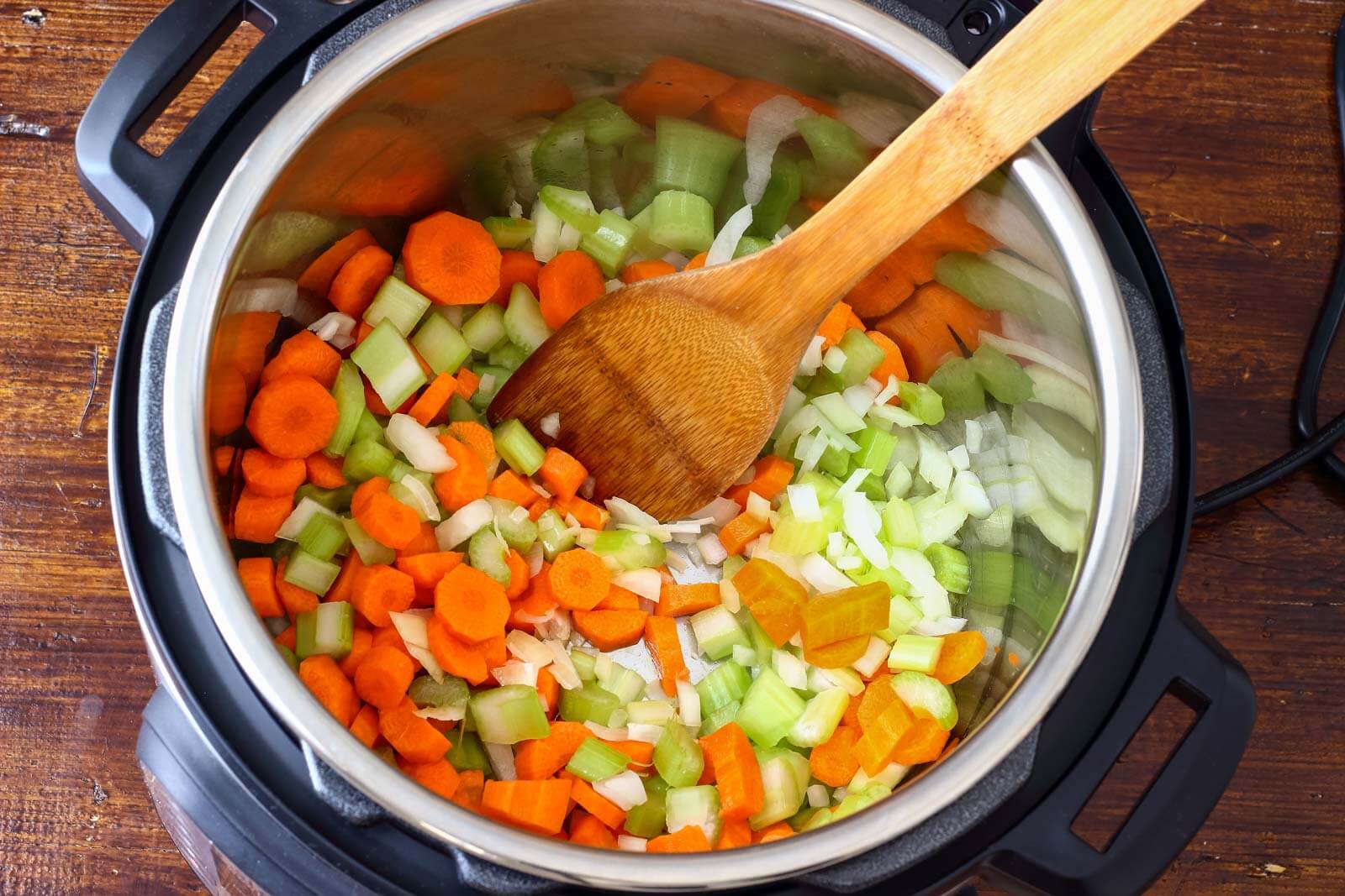 instant pot with vegetables sautéing
