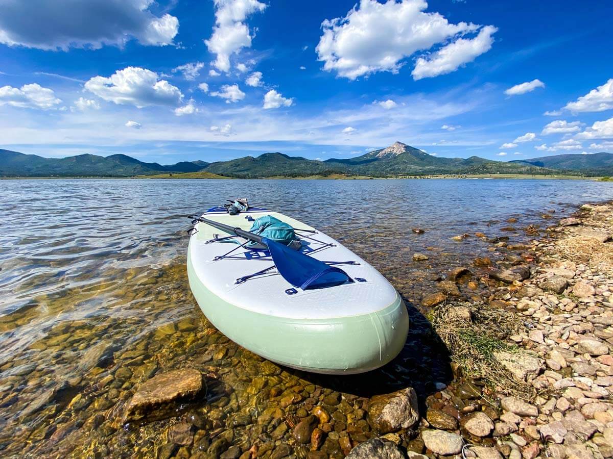 Paddleboard on a lake shore in the Colorado mountains.