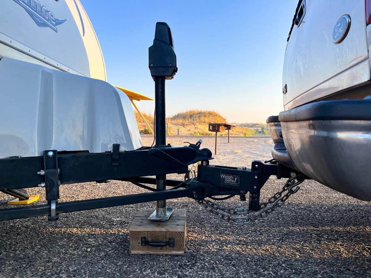 Weight distribution hitch with sway bars hooked up to travel trailer.