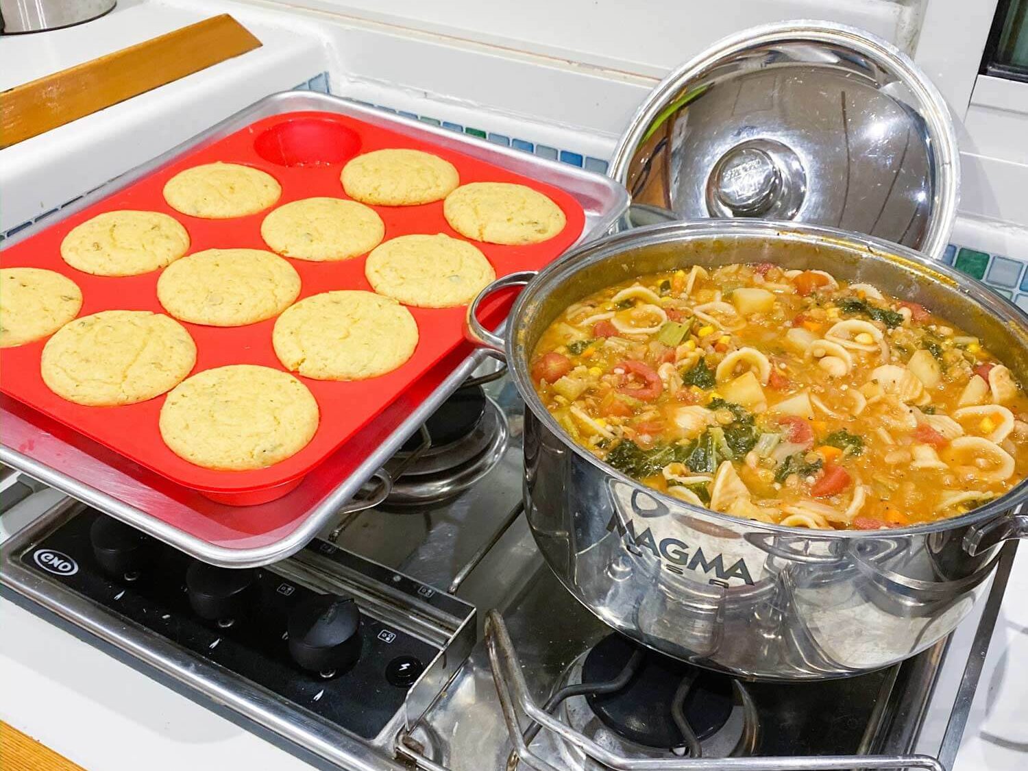 cornbread muffins and pot of soup simmering on the stuff