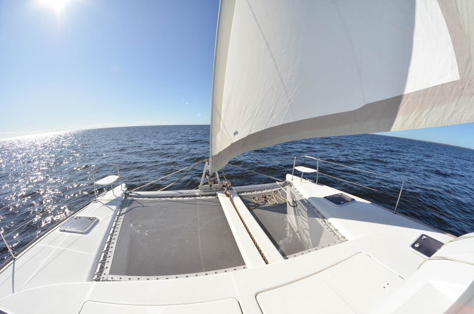 view from boat deck of sailing catamaran