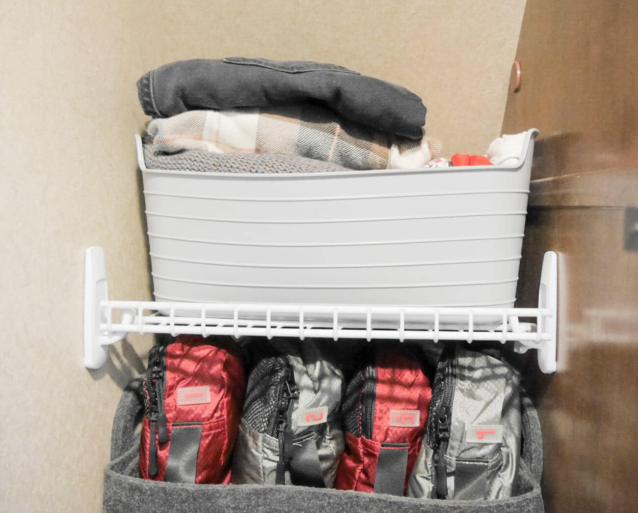 bin on top of DIY closet shelf in rv