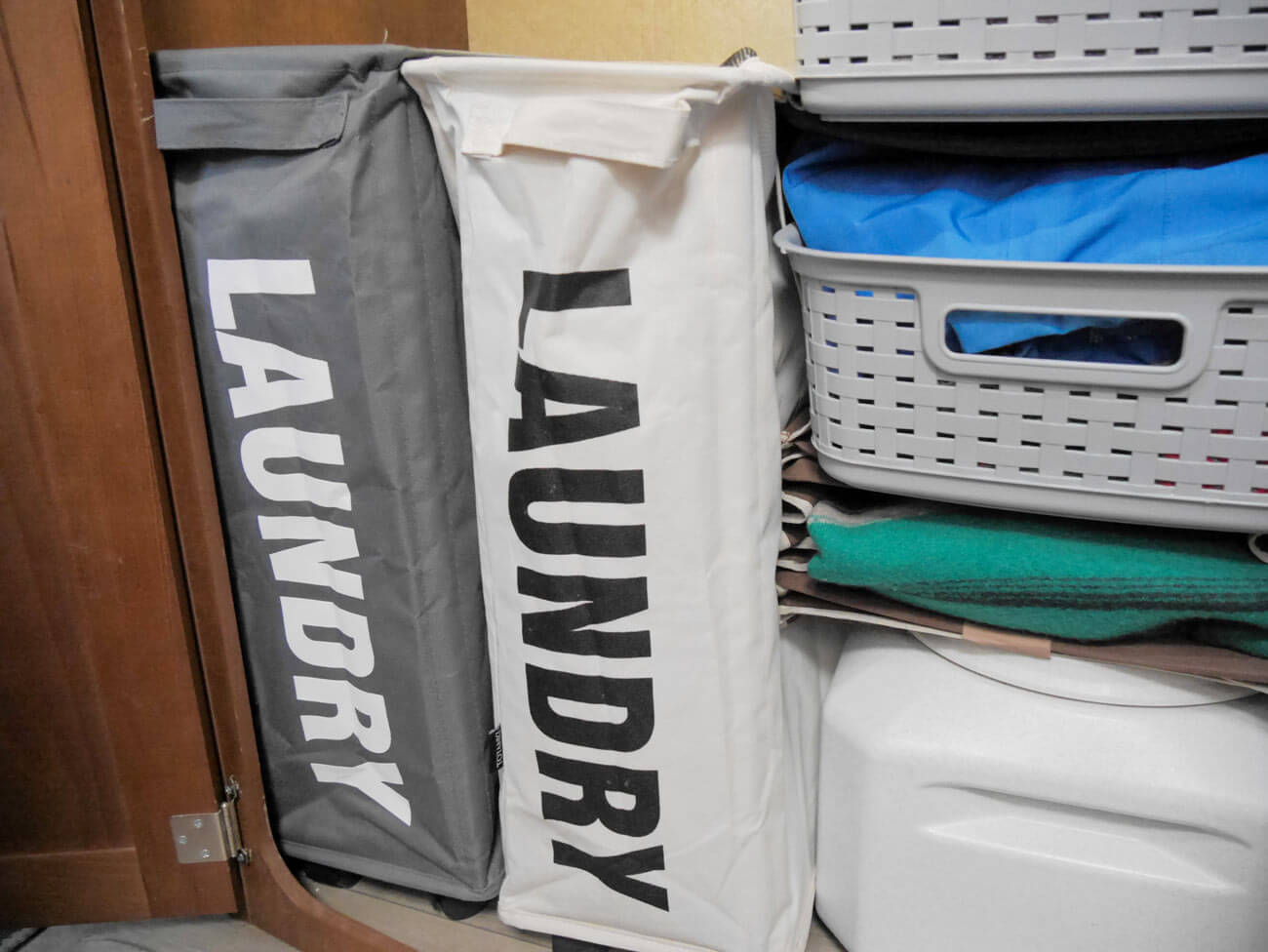 slim laundry baskets organized in rv closet