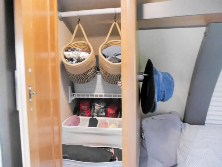 small rv storage closet with organized clothing