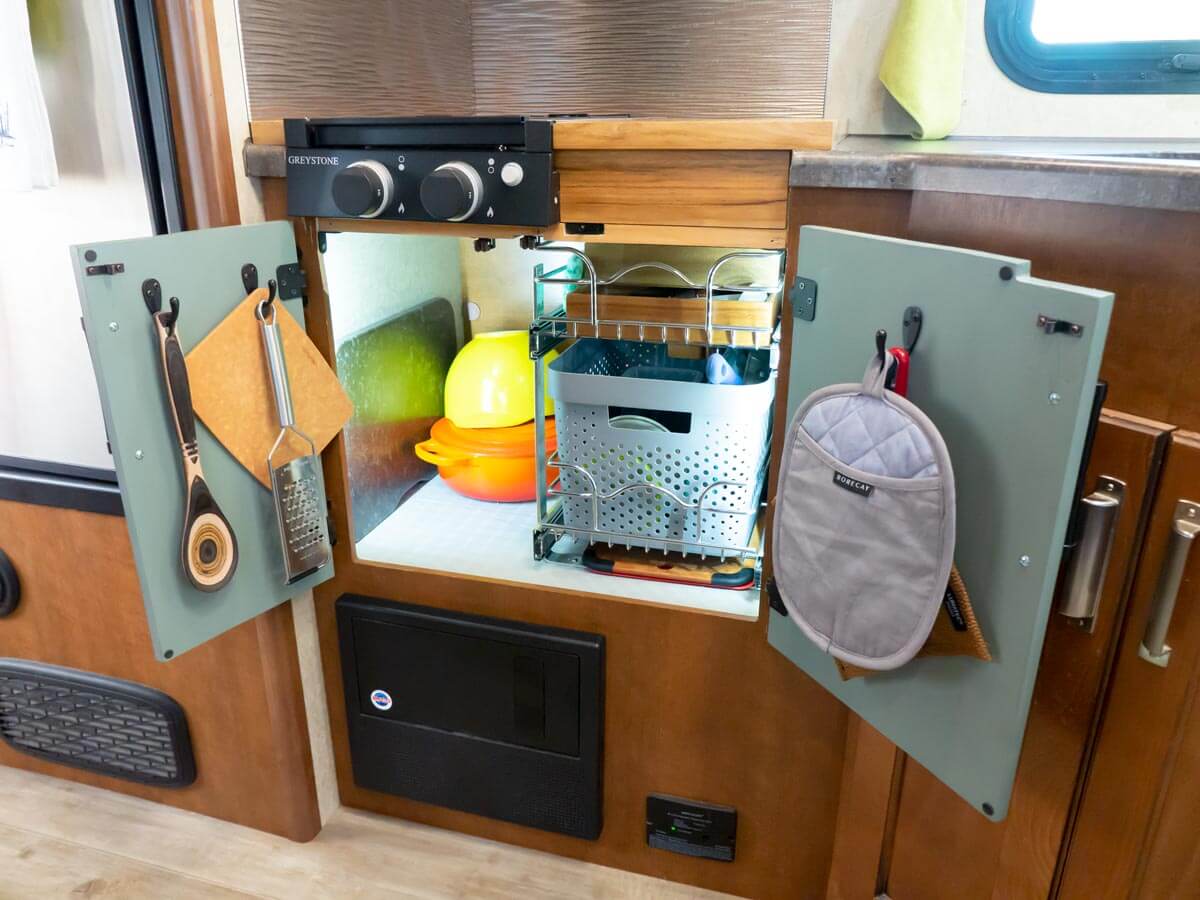 custom RV oven storage space with pull out shelf