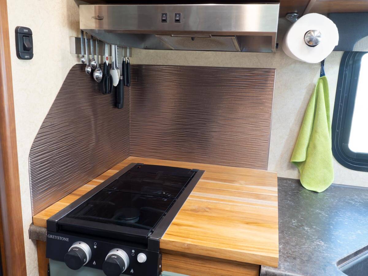custom RV kitchen two burner stovetop with bamboo top