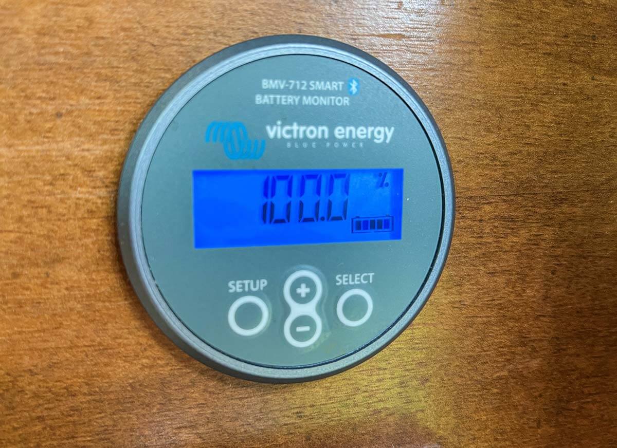 Victron battery monitor displaying 100% battery charge.
