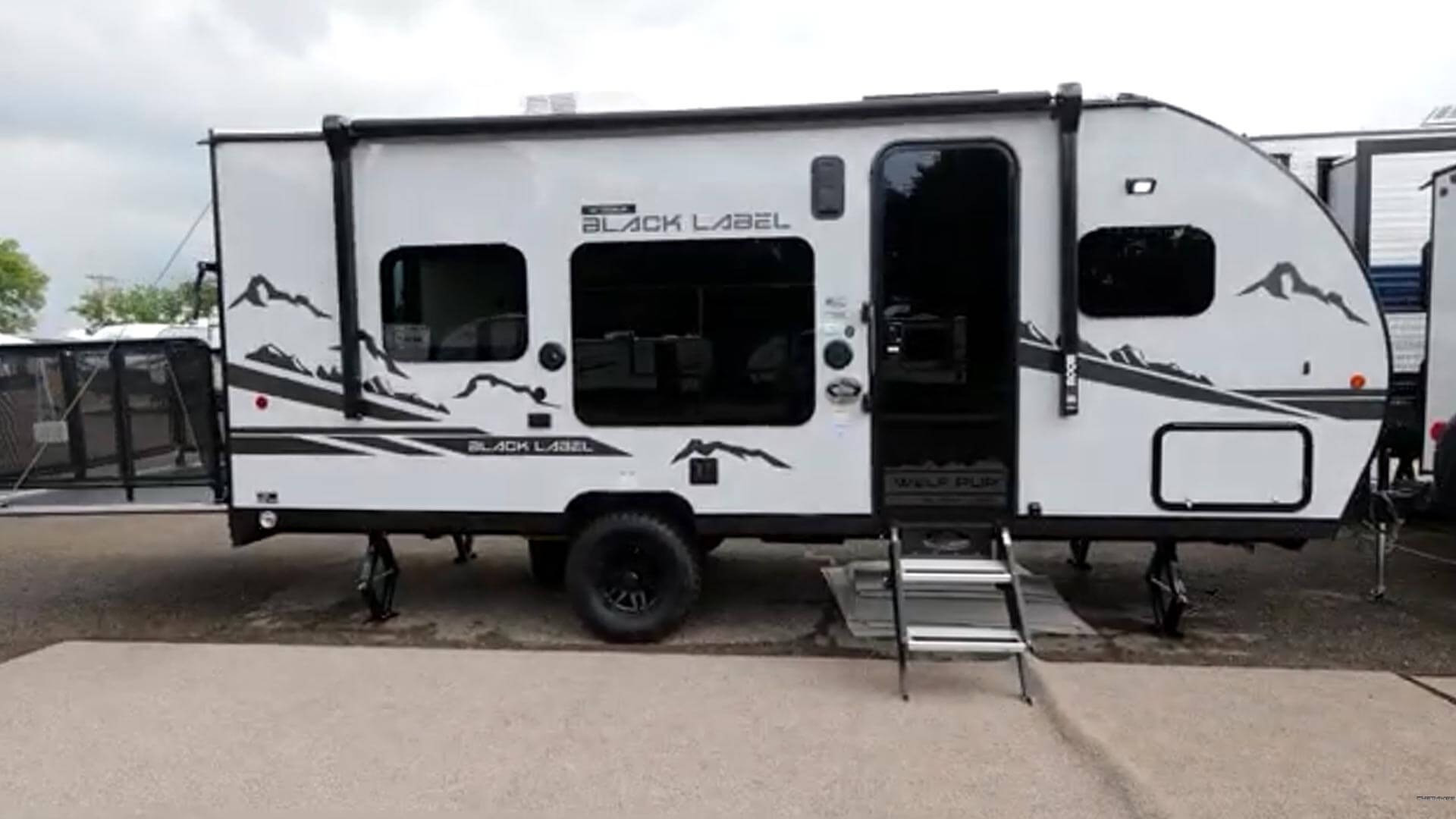 Still image of outside of Wolf Pup toy hauler from video. 
