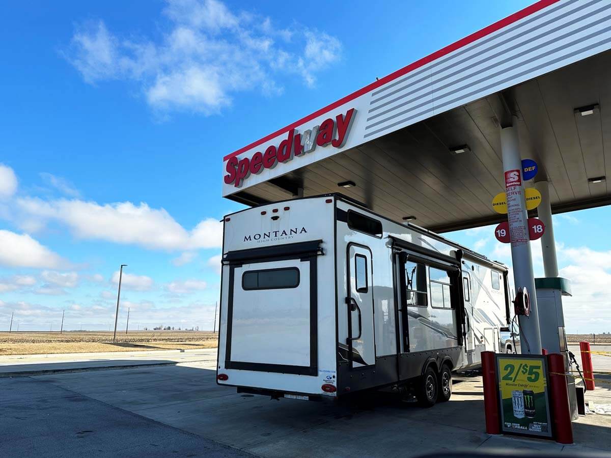 Fifth wheel RV in the truck fuel lane at a Speedway gas station.