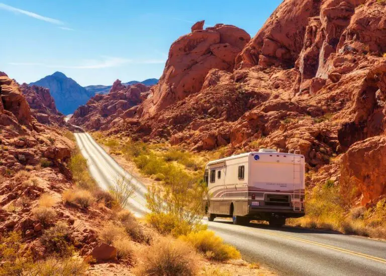 RV motorhome on small road in the American West.