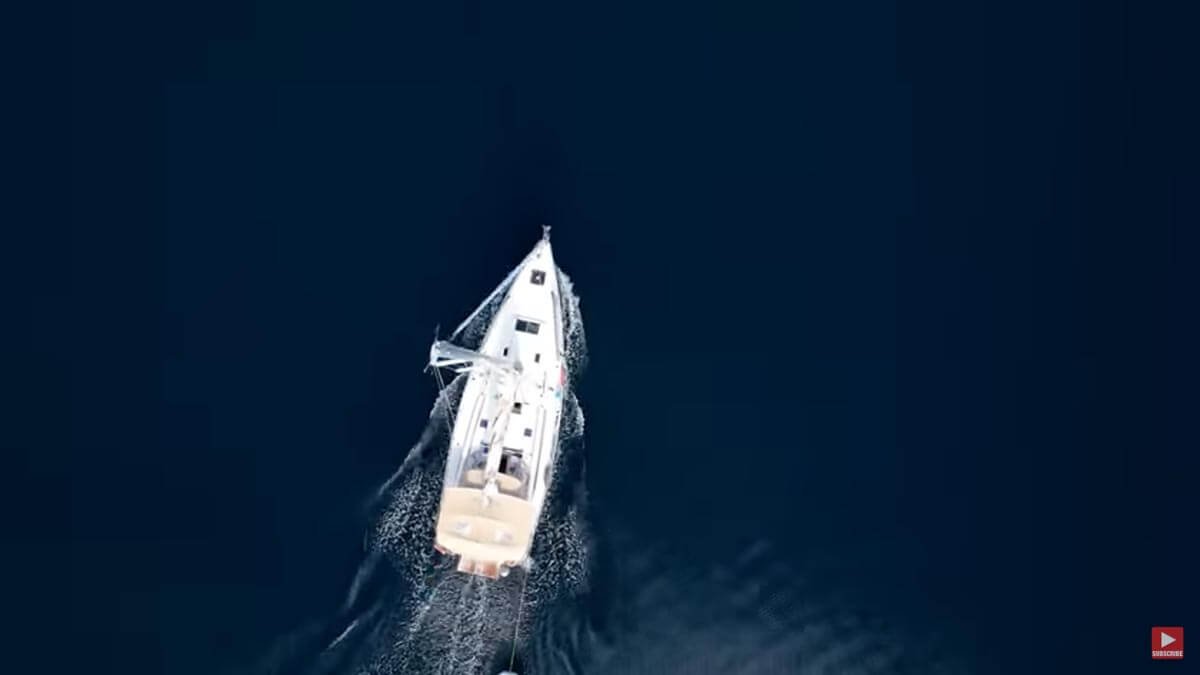 Screenshot of Sailing Doodles YouTube video with aerial shot of sailboat in the ocean.