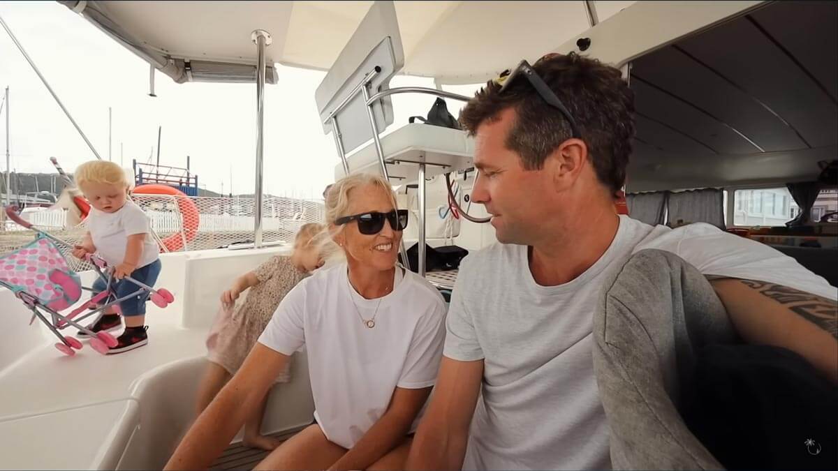 Screenshot of Sailing Nahoa YouTube video with family sitting in the cockpit of the sailboat.