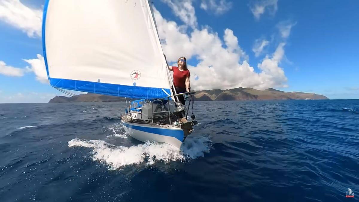 Screenshot of Sailing Yacht Florence's video of the front of the sailboat with Amy on the bow.